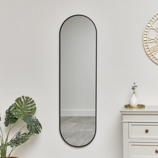 Melody Maison - Black Oval Framed Wall Mirror 140cm x 40cm